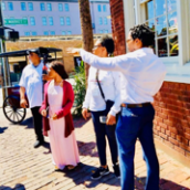 a group of people standing in front of a building